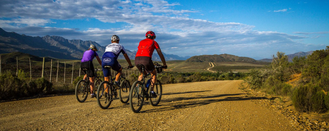 Three cyclists cycling the Cape in South Africa